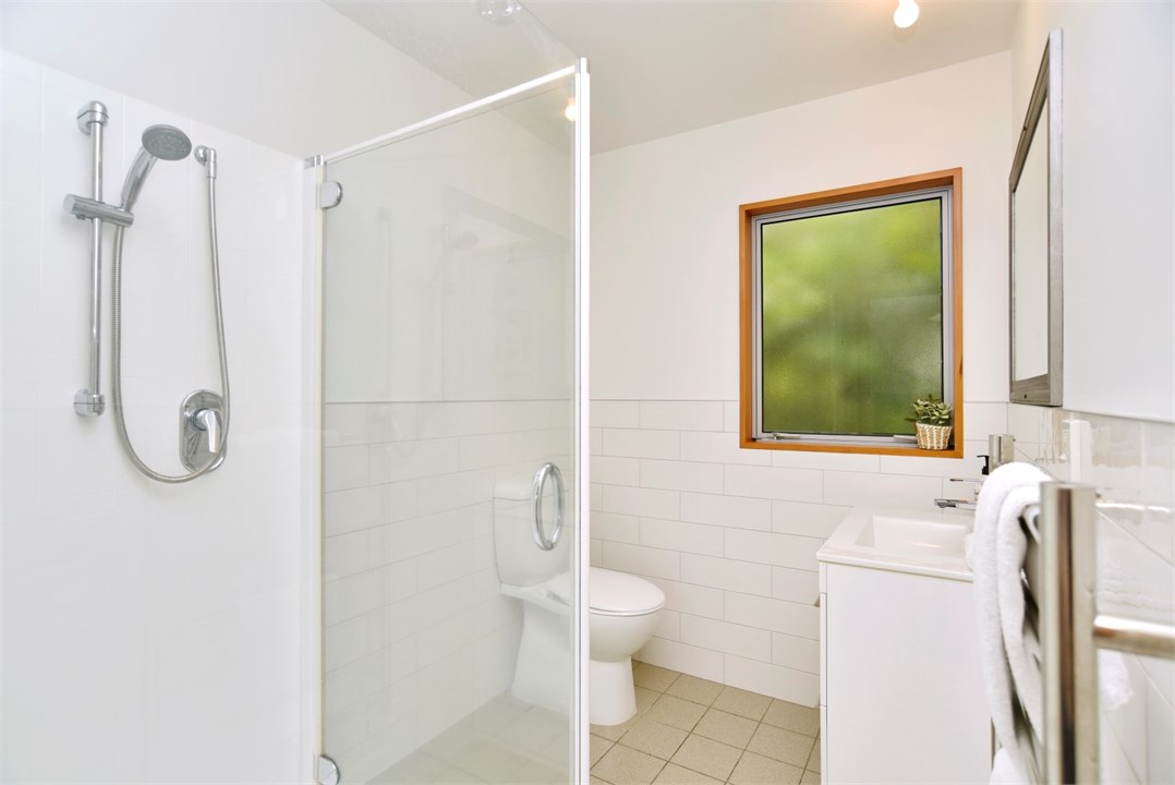 Bathroom 1 has a shower and a toilet