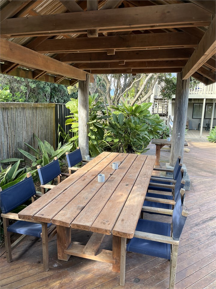 8-person dining table under bure shelter
