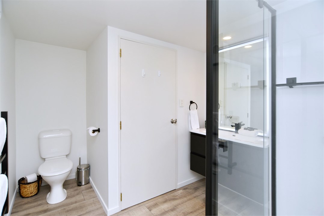 Bathroom has a shower and a toilet