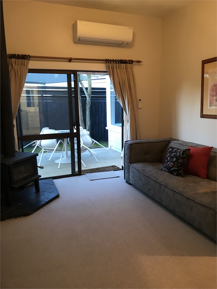 Living room with heat pump and log fire