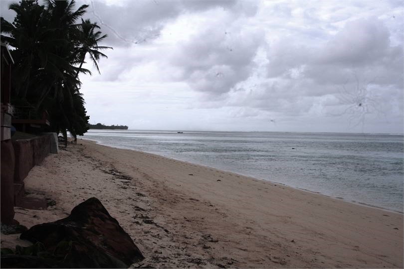 left view of beach in front of bungalow