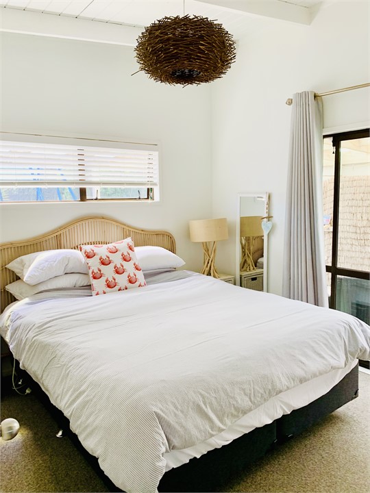 Master bedroom leads out to the back deck and dune