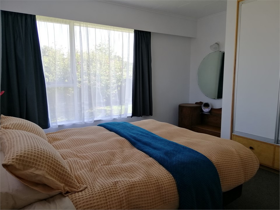 Master bedroom with queen bed