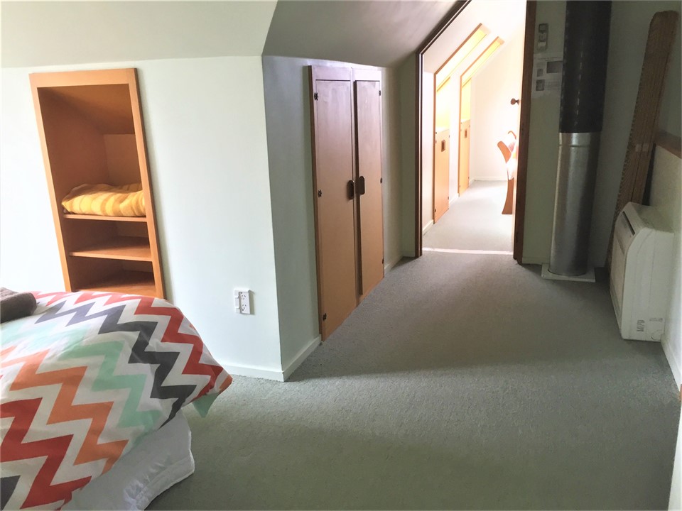 Open plan bedroom leading to queen bedroom