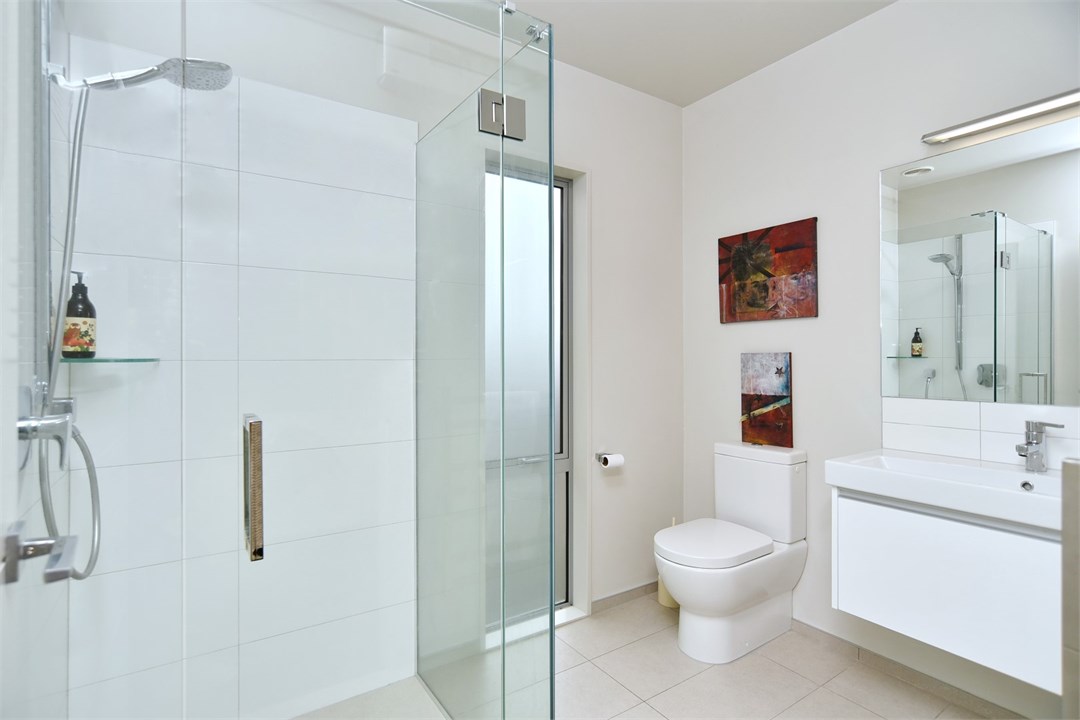 Bathroom 3 has a shower and a toilet