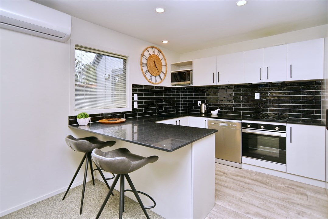 Fully equipped Kitchen area with seating at the be