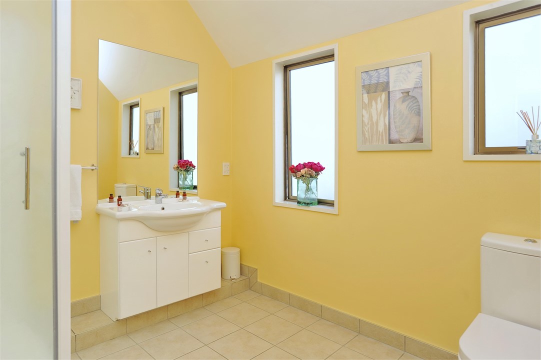 Bathroom has a shower and a toilet