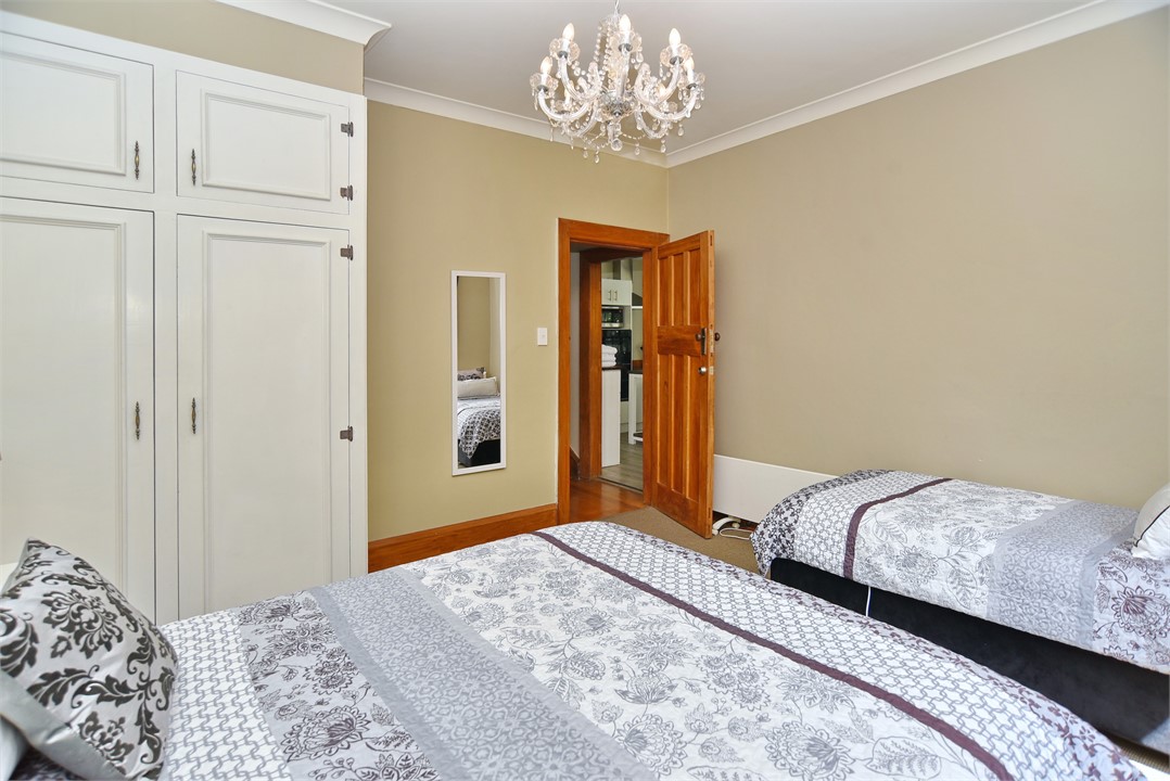 Bedroom 1 has a Queen bed and a Single bed