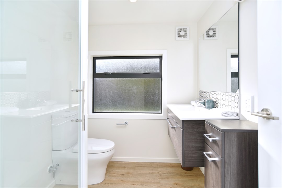 Bathroom 2 has a shower and a toilet