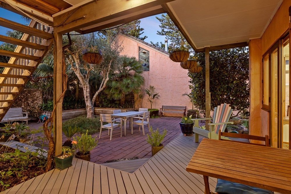Protected surround decking with table and chairs.