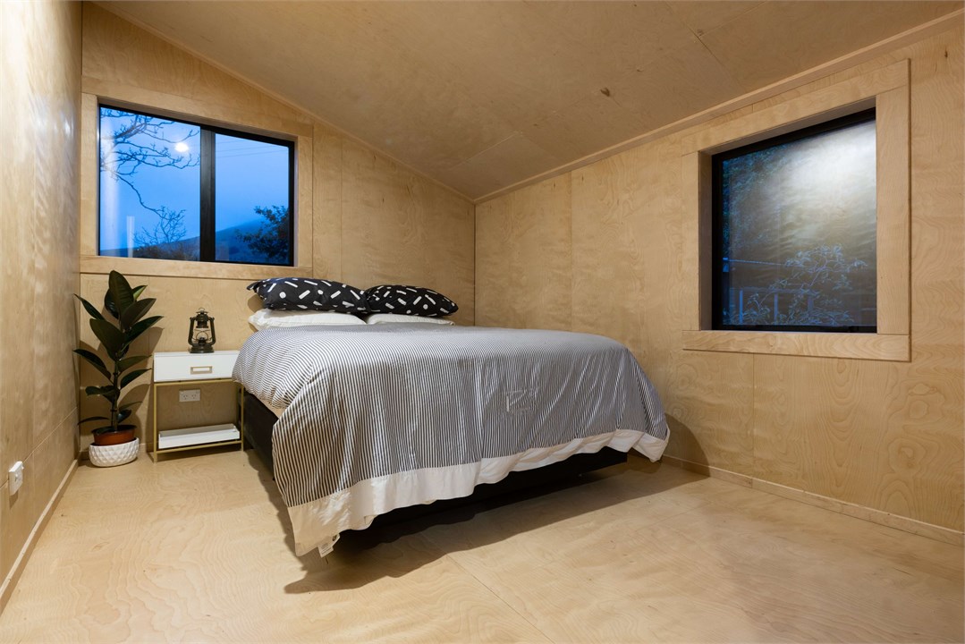 Main bedroom with door opens to deck area