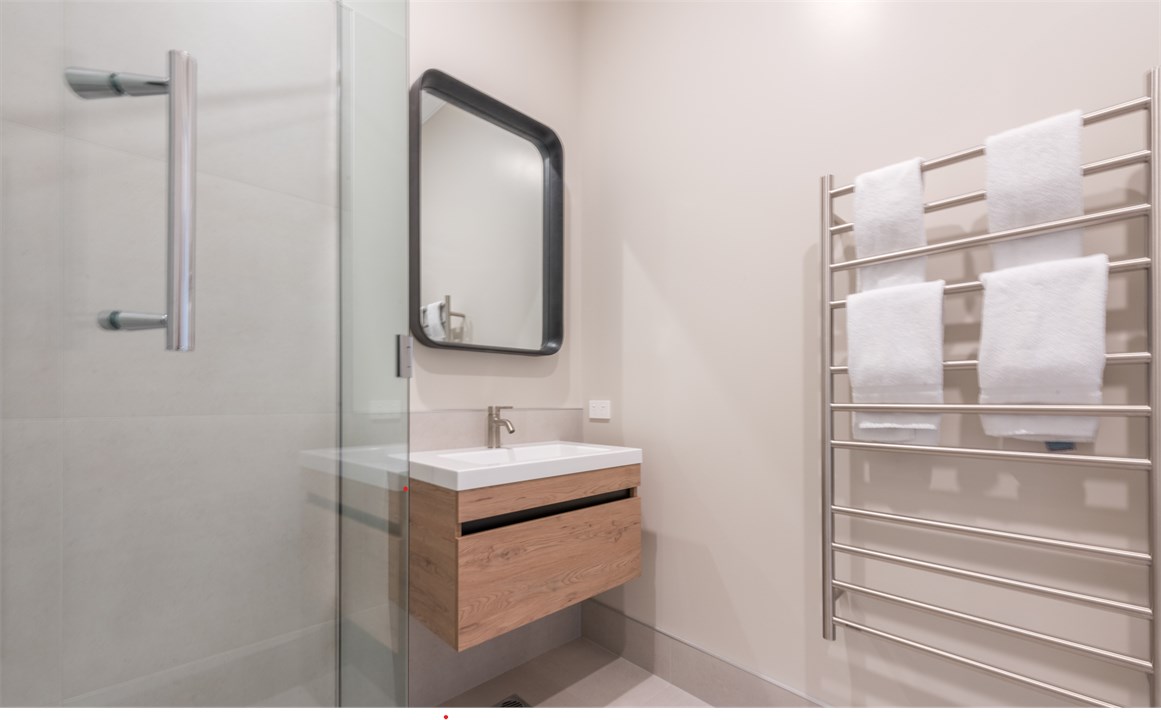 Bathroom has a shower and a toilet