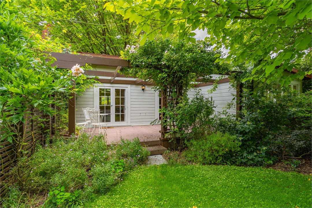 Verandah opens out into a secluded cottage garden