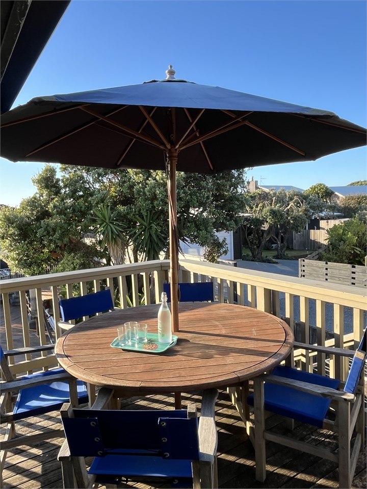 Dining table on sunny deck with great views