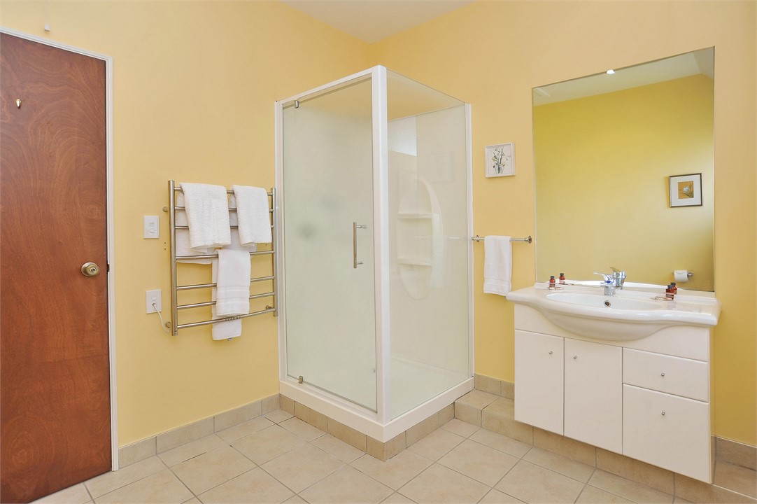 Bathroom has a shower and a toilet