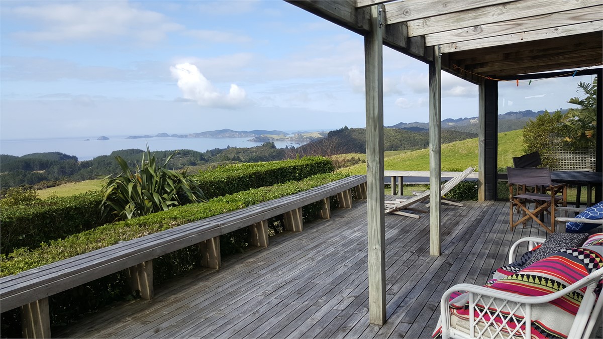 Living area opens onto large deck.