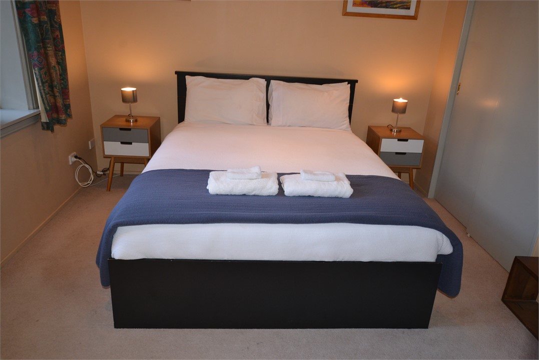 Master bedroom with queen bed