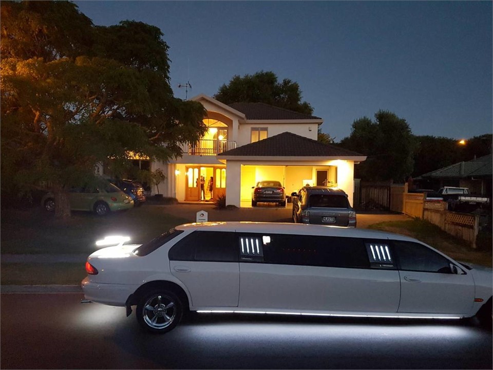 in-front of the house at night