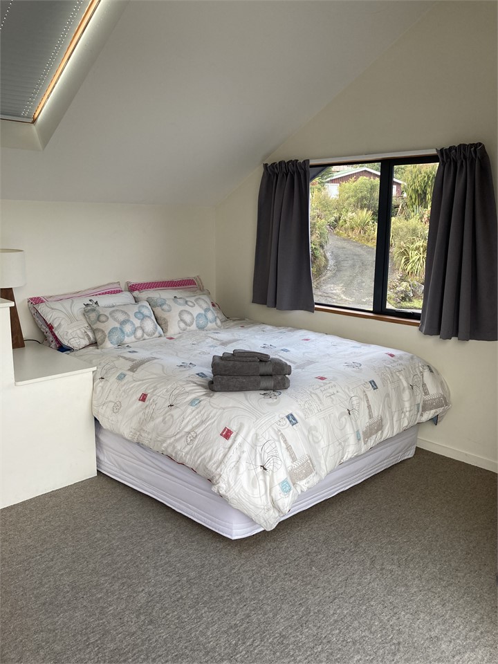 Upstairs bedroom (queen bed) with full lake view