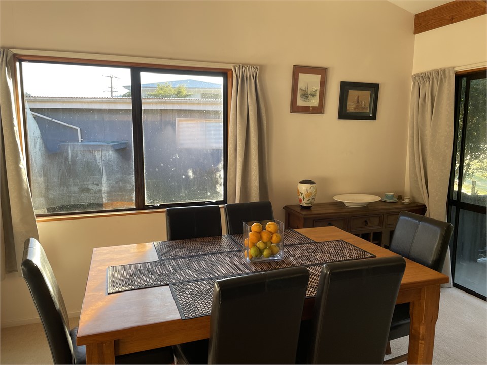 Dining room leads onto sliding doors and porch.