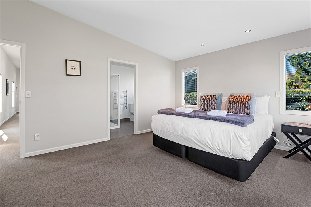 Master bedroom with king bed, ensuite & smart tv
