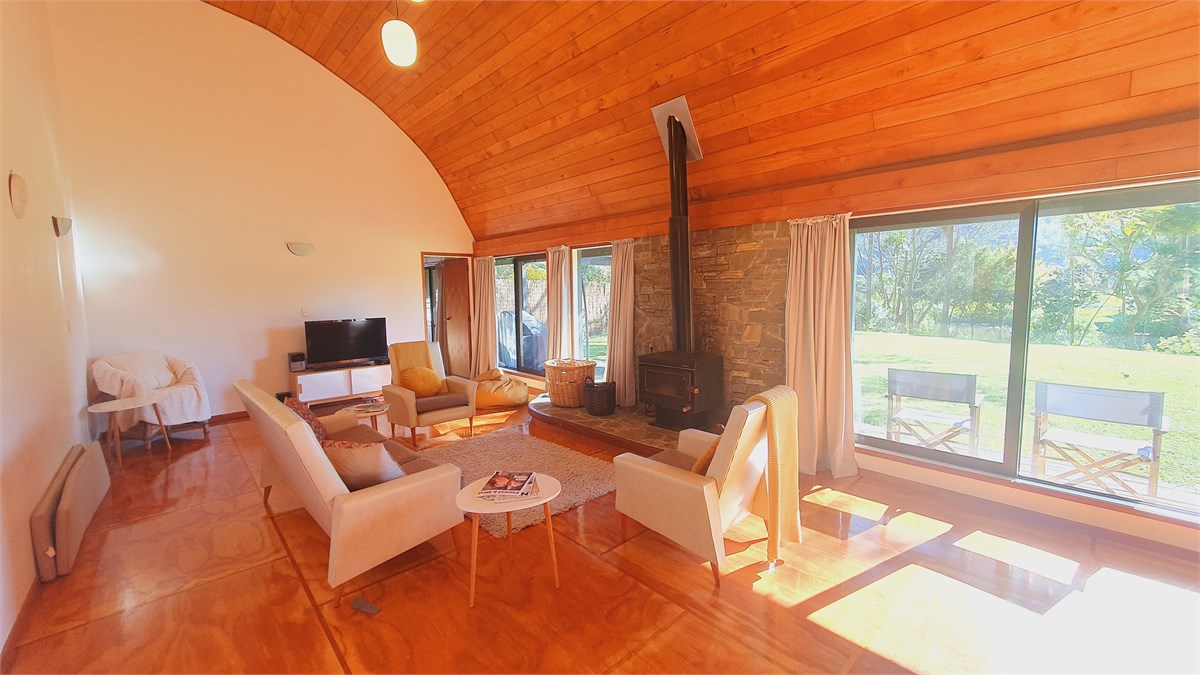 Sunny open plan living area looking out to the riv