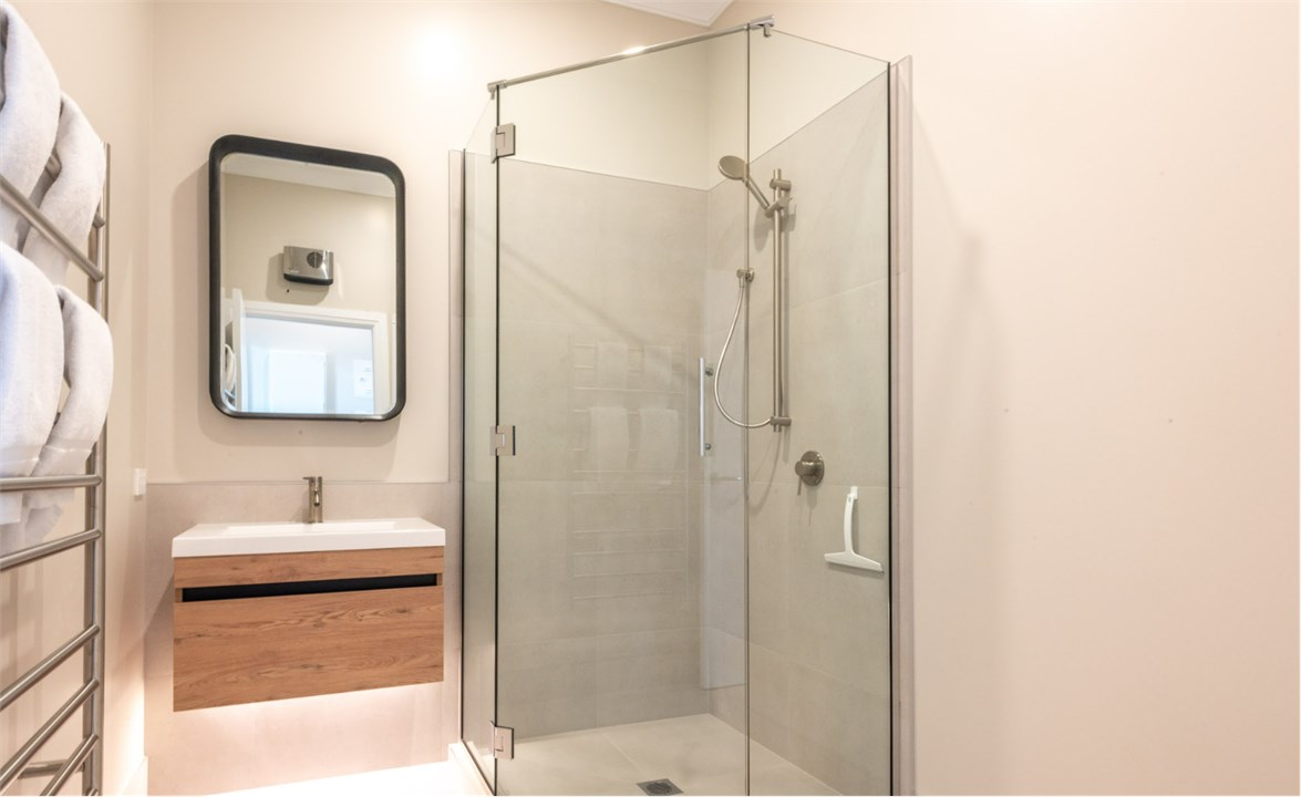 Bathroom has a shower and a toilet