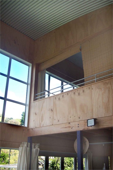 bedroom overlooking lounge to sea views