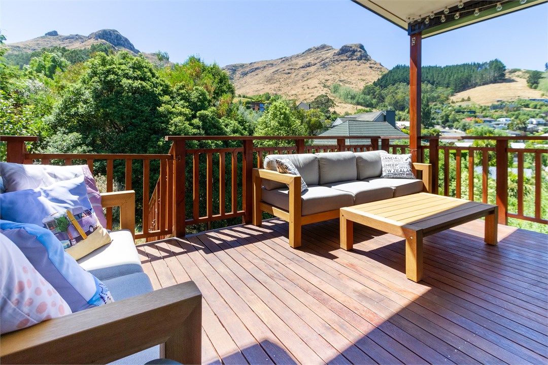 Spacious BBQ deck with comfy seating and beautiful