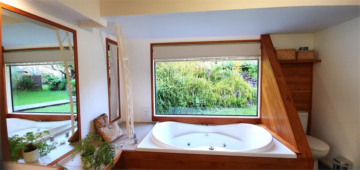 Spacious en suite bathroom with spa bath, shower a