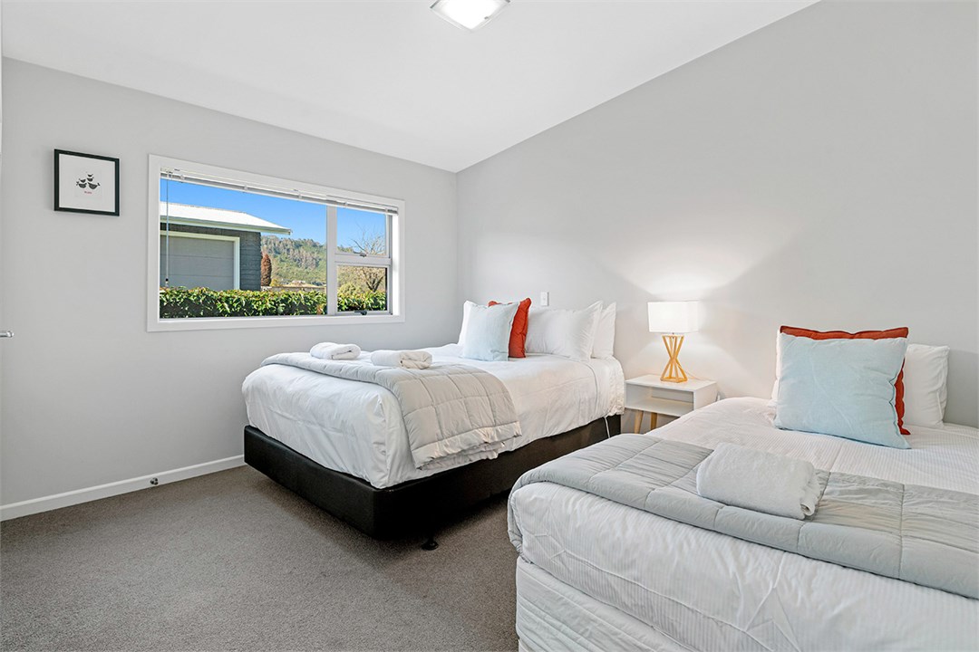 Second bedroom with queen bed & king single