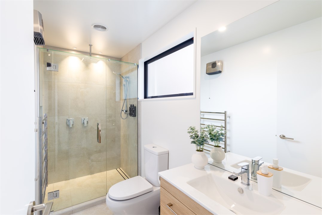 Bathroom 1 has a shower and a toilet