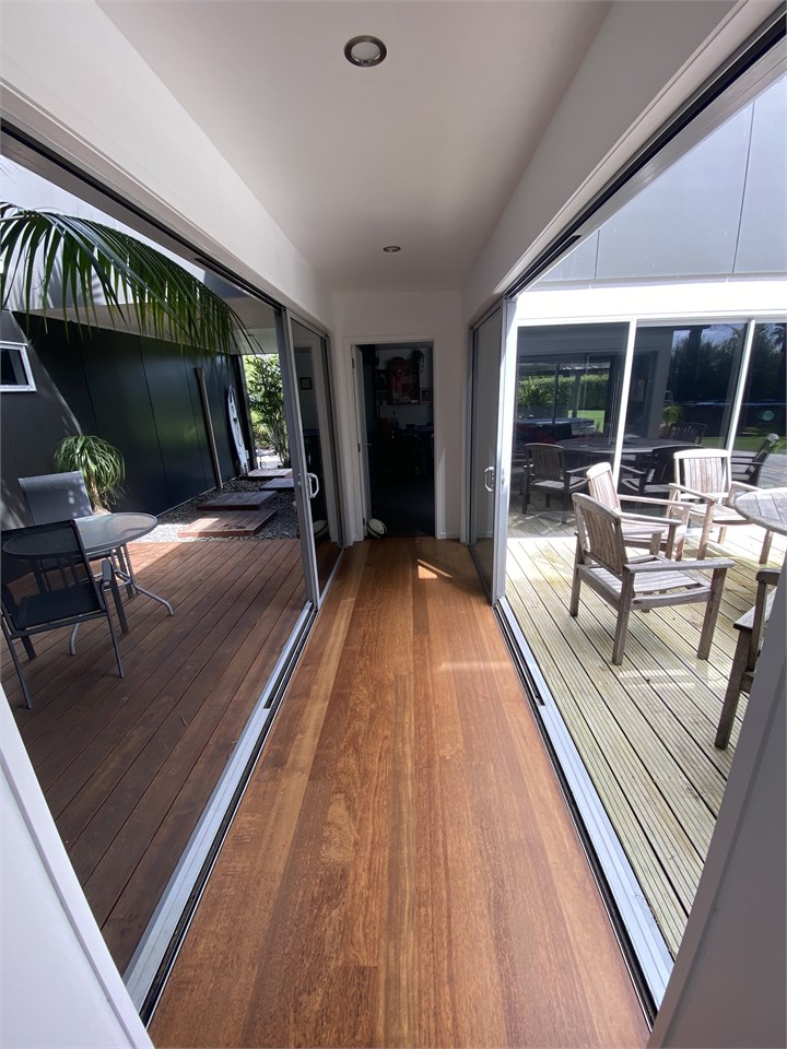 Down stairs hall way opens up indoor outdoor flow