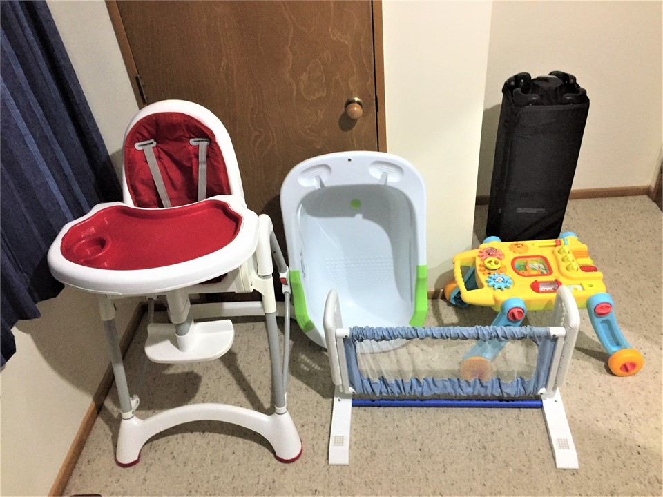 Baby high chair, bath, bed rail and portable cot