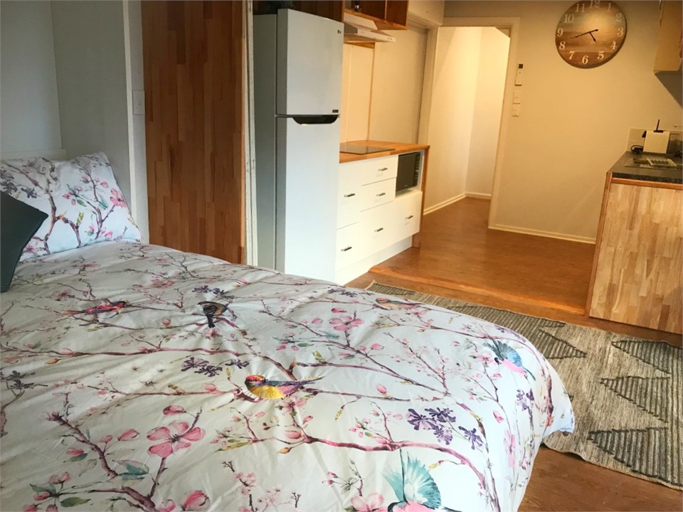 Double pull-down Murphy bed in living area