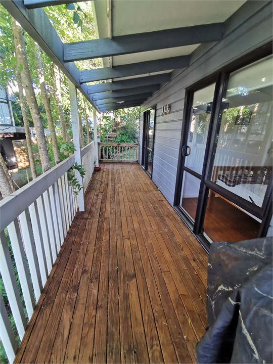 Side deck with gate along the length the property 