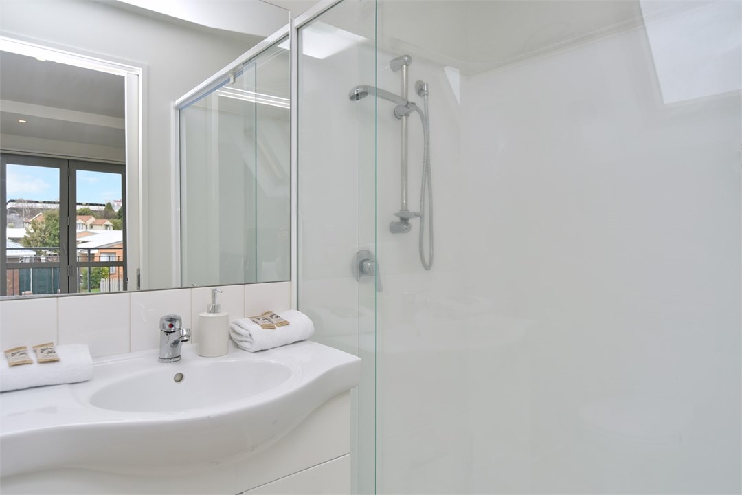 Bathroom 2 has a shower and a toilet