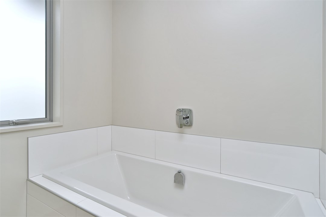 Bathroom 2 has a shower, toilet and a bath