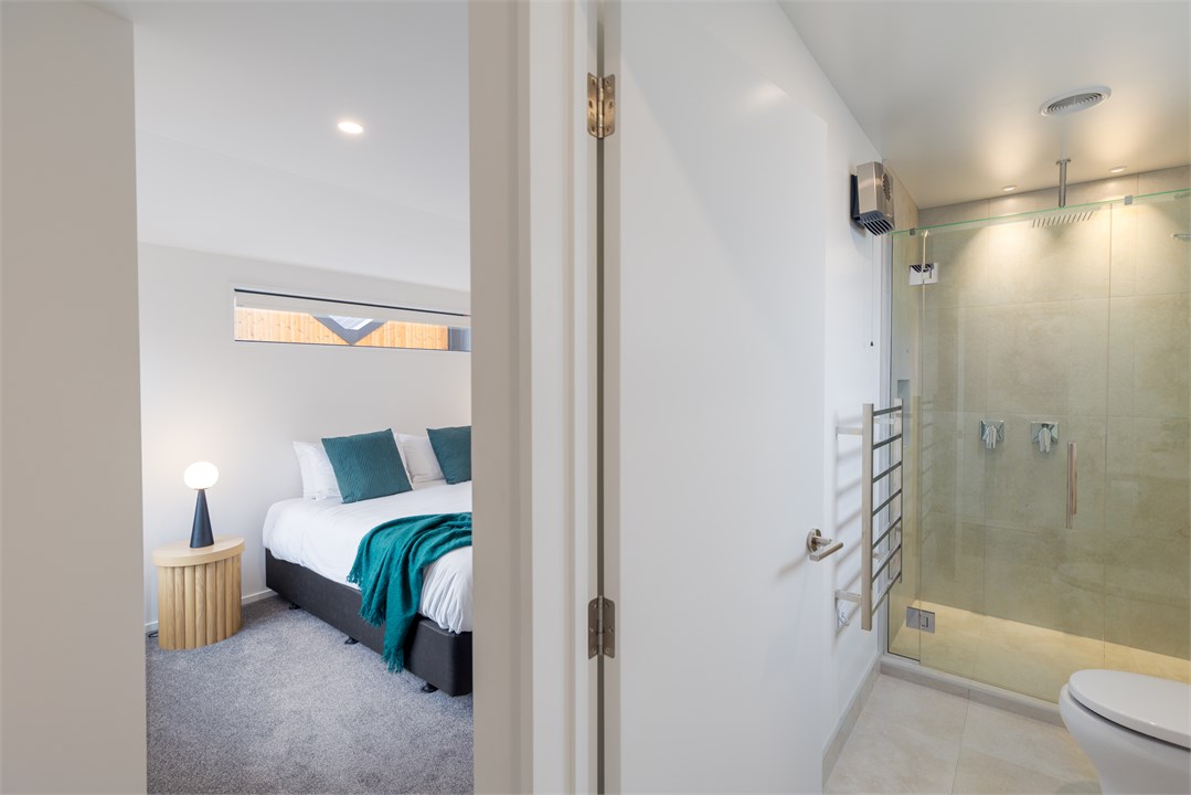 Bathroom 1 has a shower and a toilet