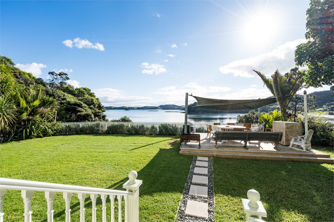 The front deck with large flat lawn area