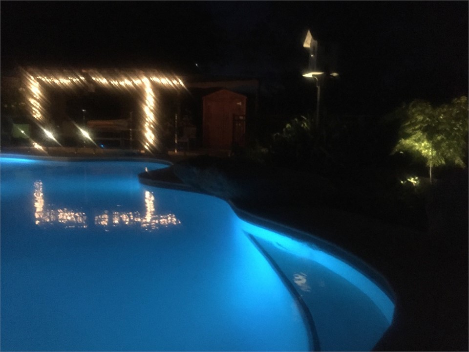 On site pool by night