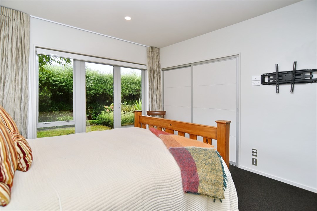 Bedroom 3 has a Queen bed and a seating area