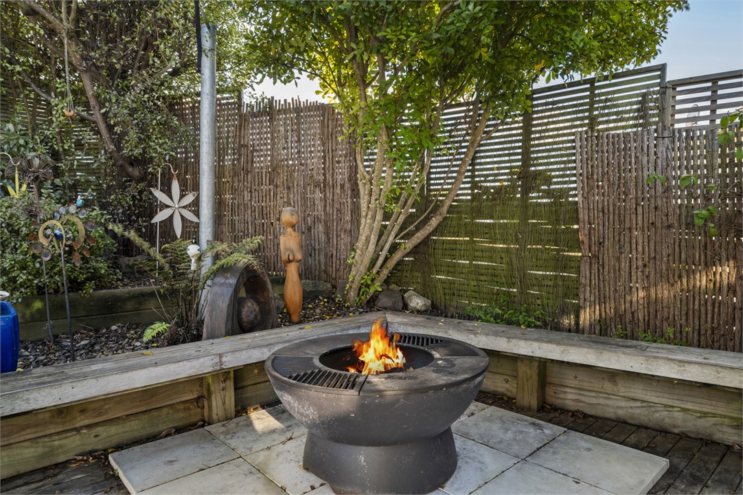 Private outdoor garden with fire-pit