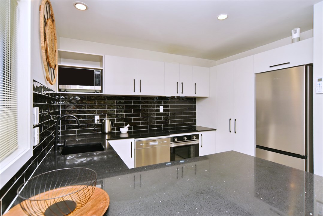 Fully equipped Kitchen area with seating at the be