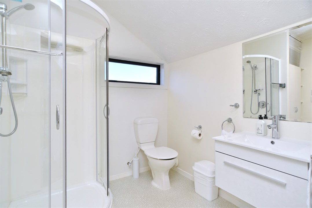 Bathroom 2 has a shower and a toilet