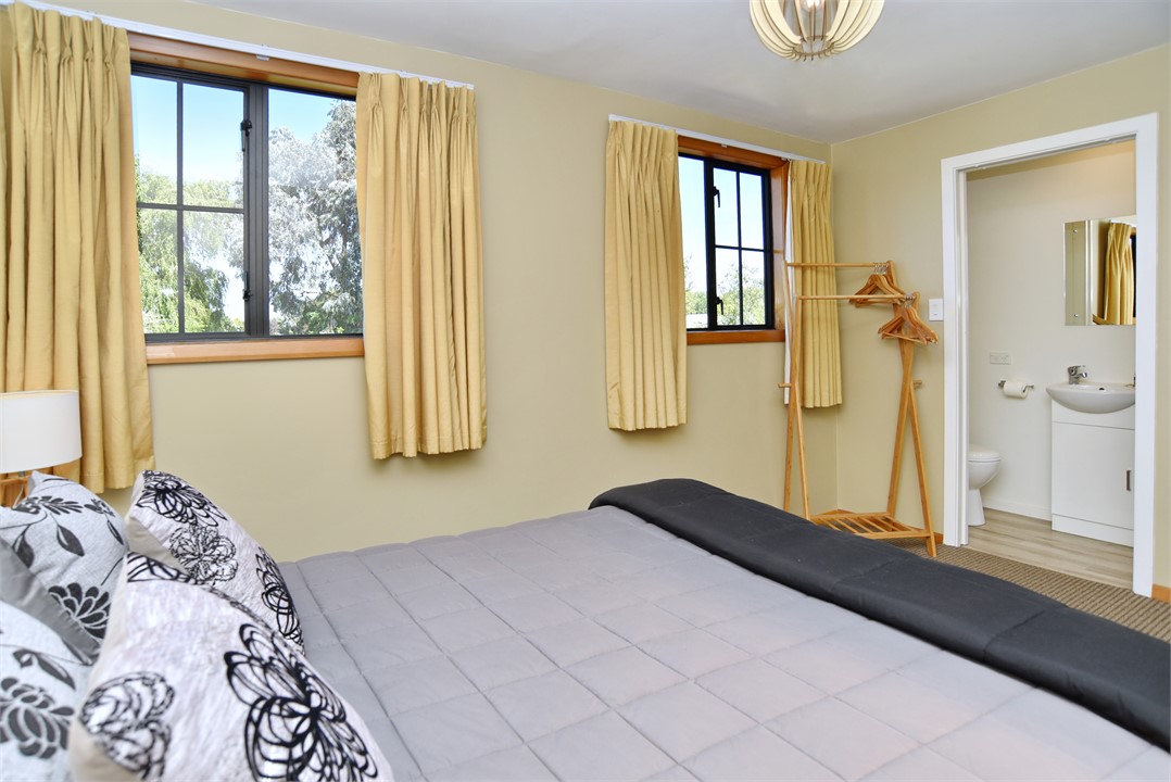 Bedroom 3 has a Queen bed