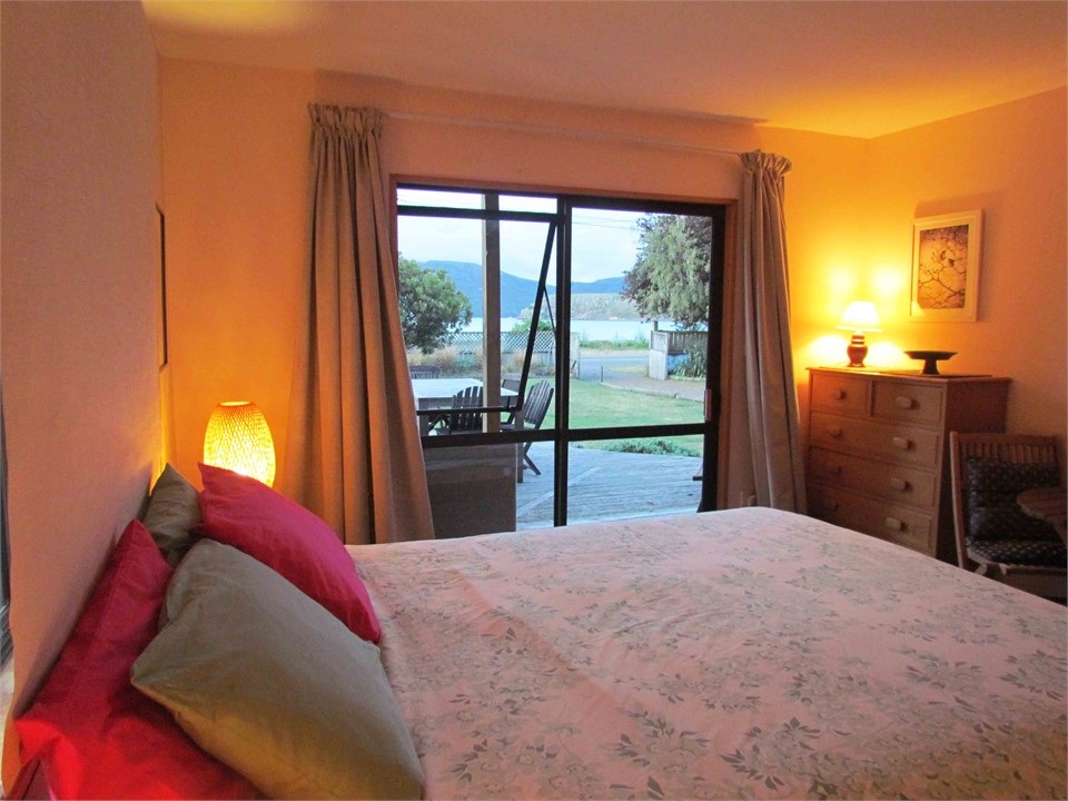 View from main bedroom out onto decking and sea