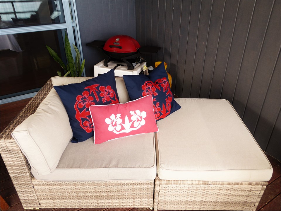 there is a table, chairs, couch & BBQ on the deck