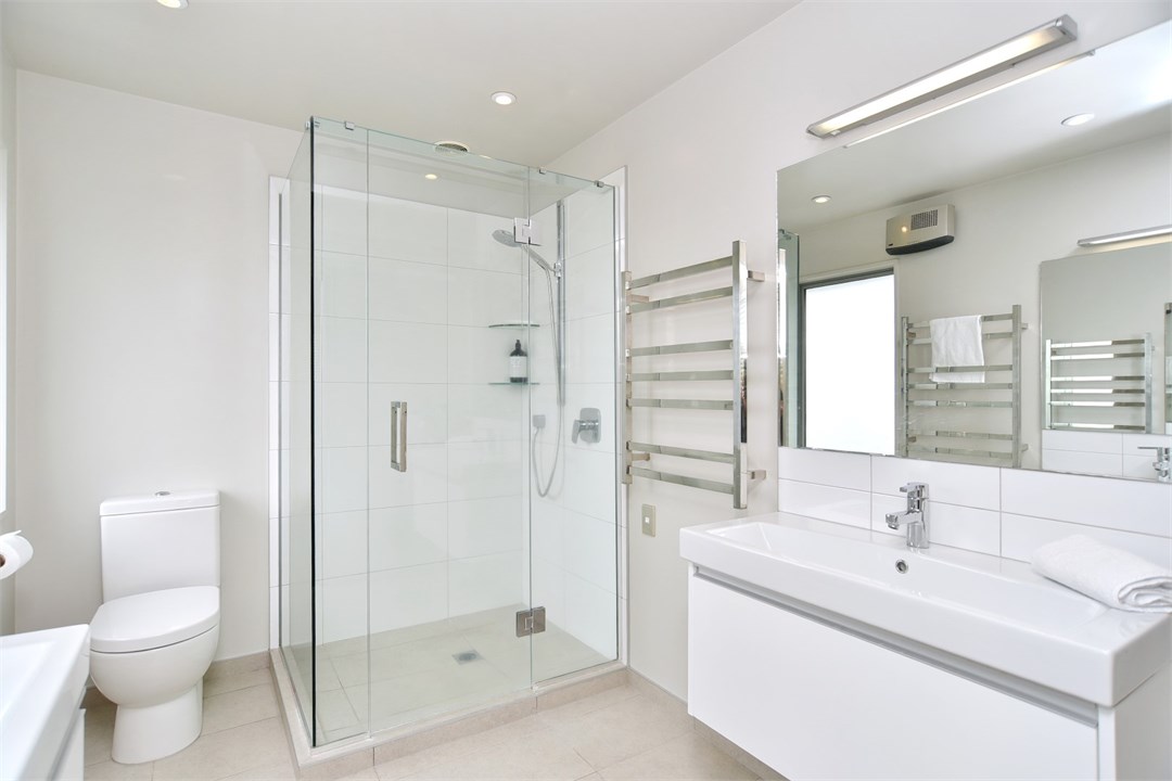 Bathroom 1 is an ensuite and has a shower and a to