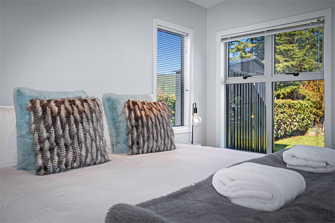 Master bedroom with king bed, ensuite & smart tv